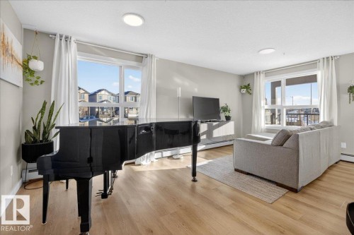 125 1506 Tamarack Boulevard, Edmonton, AB - Indoor Photo Showing Living Room