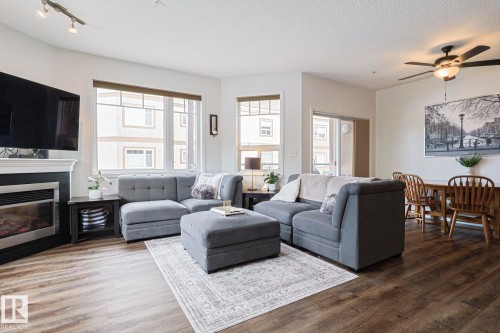 111 2035 Grantham Crest Nw, Edmonton, AB - Indoor Photo Showing Living Room With Fireplace