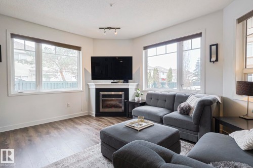 111 2035 Grantham Crest Nw, Edmonton, AB - Indoor Photo Showing Living Room With Fireplace
