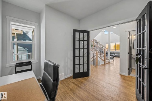 Unfurnished office featuring light wood-type flooring and french doors - 34 Riverhill Crescent, St. Albert, AB - Indoor