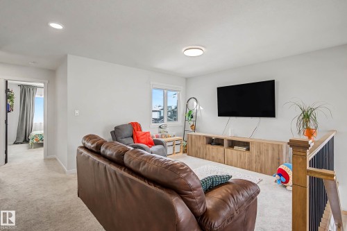 Living room featuring light colored carpet and recessed lighting - 34 Riverhill Crescent, St. Albert, AB - Indoor Photo Showing Living Room