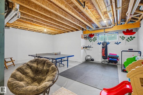 Playroom with concrete flooring - 34 Riverhill Crescent, St. Albert, AB - Indoor