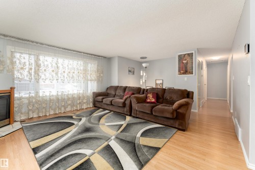 3505 42 Street, Leduc, AB - Indoor Photo Showing Living Room With Fireplace