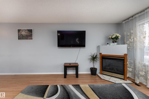 3505 42 Street, Leduc, AB - Indoor Photo Showing Living Room With Fireplace