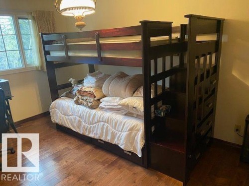Bedroom featuring dark wood-style flooring - 206 Wolf Willow Crescent, Edmonton, AB - Indoor Photo Showing Bedroom
