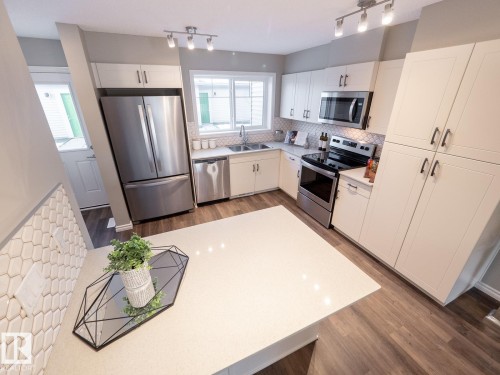 50 Brougham Drive, Ardrossan, AB - Indoor Photo Showing Kitchen With Stainless Steel Kitchen With Double Sink