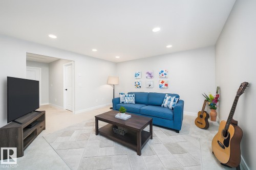 Living area with light carpet and recessed lighting - 15 Chambery Crescent, St. Albert, AB - Indoor Photo Showing Living Room