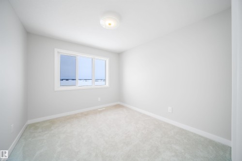 Spare room featuring baseboards and light carpet - 15 Chambery Crescent, St. Albert, AB - Indoor Photo Showing Other Room