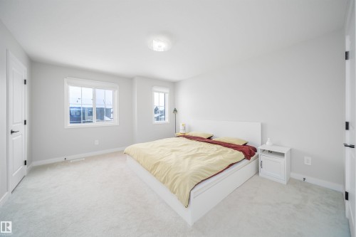 Bedroom with light carpet and baseboards - 15 Chambery Crescent, St. Albert, AB - Indoor Photo Showing Bedroom