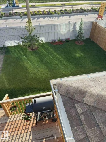 Fenced backyard with a wooden deck - 15 Chambery Crescent, St. Albert, AB - Outdoor
