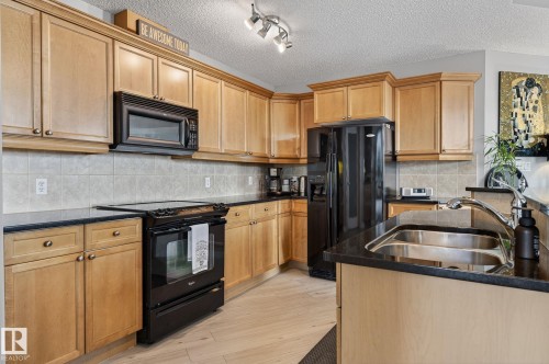 1703 9020 Jasper Avenue, Edmonton, AB - Indoor Photo Showing Kitchen With Double Sink