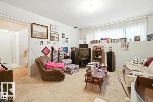Living area with light carpet and baseboards - 14936 81 Street, Edmonton, AB - Indoor Photo Showing Living Room