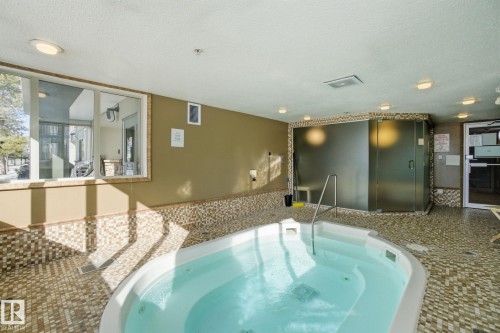 208 278 Suder Greens Drive Nw, Edmonton, AB - Indoor Photo Showing Other Room With In Ground Pool