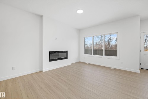 8728 183 Avenue, Edmonton, AB - Indoor Photo Showing Living Room With Fireplace