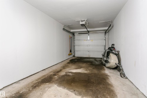 Tandem Garage - 4011 Orchards Drive, Edmonton, AB - Indoor Photo Showing Garage