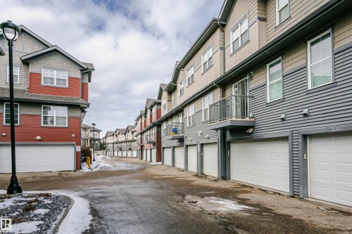 View of asphalt road with a residential view - 4011 Orchards Drive, Edmonton, AB - Outdoor