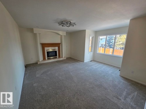 3676 30 Street, Edmonton, AB - Indoor Photo Showing Living Room With Fireplace