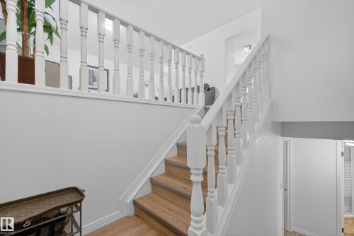 Stairs featuring wood finished floors - 17303 101 Street, Edmonton, AB - Indoor Photo Showing Other Room