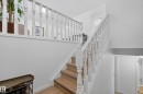 Stairs featuring wood finished floors - 17303 101 Street, Edmonton, AB  - Indoor Photo Showing Other Room 