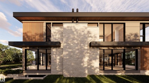 Back of house featuring a sunroom and stone siding - 9804 143 Street, Edmonton, AB - Outdoor With Exterior