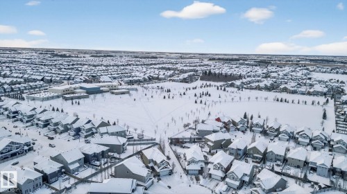 Snowy aerial view with a residential view - 60 1804 70 Street, Edmonton, AB - Outdoor With View