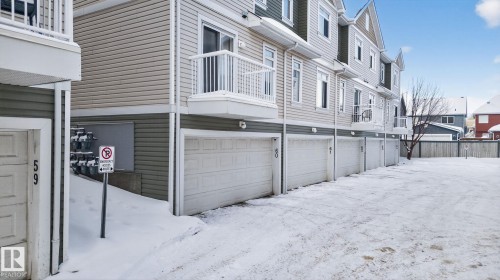 View of property exterior with an attached garage, a residential view, and a balcony - 60 1804 70 Street, Edmonton, AB - Outdoor With Exterior