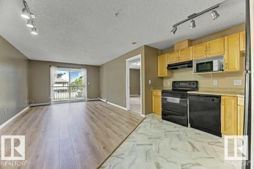 211 245 Edwards Dr Sw, Edmonton, AB - Indoor Photo Showing Kitchen