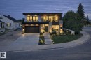 Modern home with stone siding, driveway, a garage, and a balcony - 12436 St Albert Trail, Edmonton, AB 