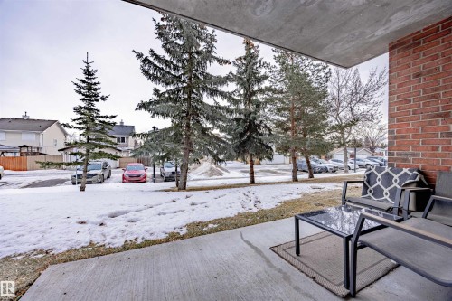 Snow covered patio featuring a residential view - 132 6220 134 Avenue, Edmonton, AB - Outdoor