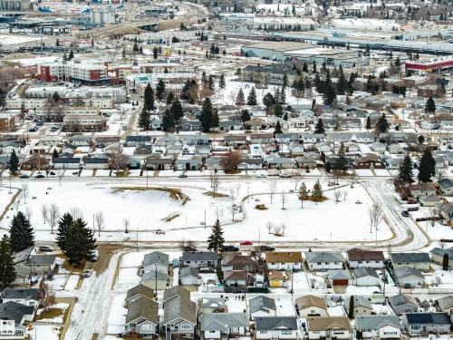 Snowy aerial view featuring a residential view - 132 6220 134 Avenue, Edmonton, AB - Outdoor With View