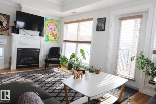 406 10232 115 Street, Edmonton, AB - Indoor Photo Showing Living Room With Fireplace