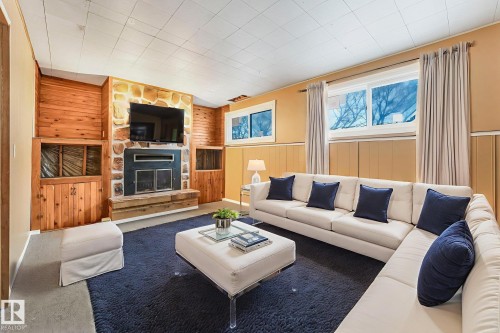 58 Huron Street S, Devon, AB - Indoor Photo Showing Living Room With Fireplace