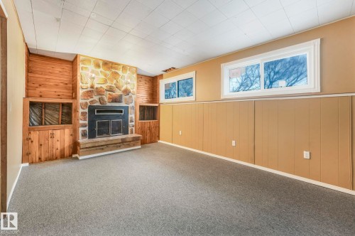 58 Huron Street S, Devon, AB - Indoor With Fireplace