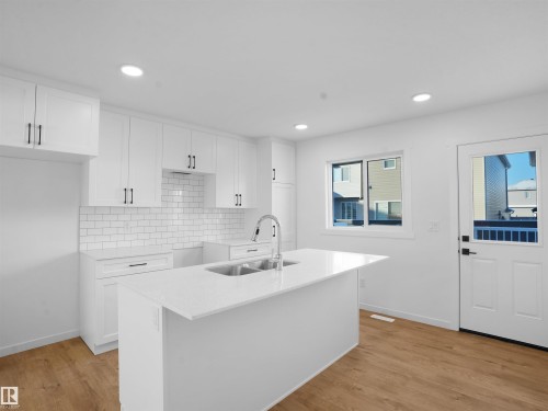 32 1009 Cy Becker Road, Edmonton, AB - Indoor Photo Showing Kitchen With Double Sink With Upgraded Kitchen