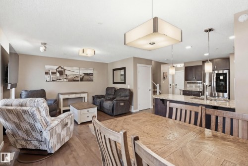 Dining room featuring light wood-type flooring and baseboards - 2031 Westerra Loop, Stony Plain, AB - Indoor