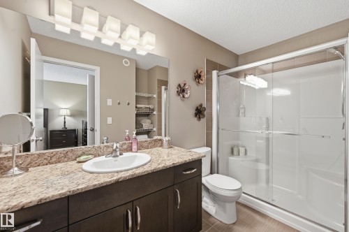 Bathroom with vanity, a shower stall, and a textured ceiling - 2031 Westerra Loop, Stony Plain, AB - Indoor Photo Showing Bathroom