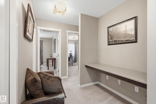 Corridor with light carpet and a textured ceiling - 2031 Westerra Loop, Stony Plain, AB - Indoor Photo Showing Other Room