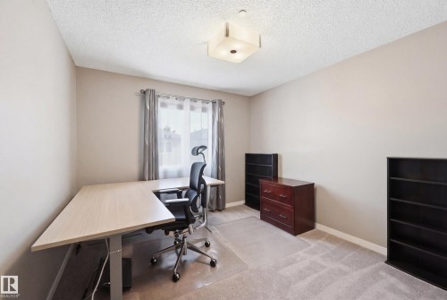 Home office with light colored carpet and a textured ceiling - 2031 Westerra Loop, Stony Plain, AB - Indoor Photo Showing Office