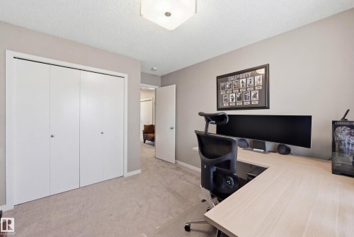 Office area featuring light colored carpet and a textured ceiling - 2031 Westerra Loop, Stony Plain, AB - Indoor