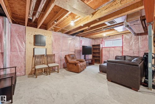 Living room with concrete flooring - 2031 Westerra Loop, Stony Plain, AB - Indoor Photo Showing Basement