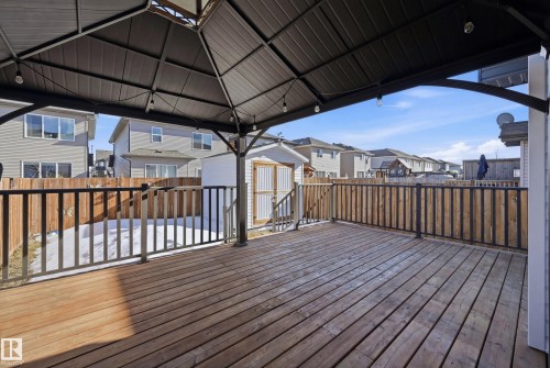 Deck with a residential view, a shed, and a fenced backyard - 2031 Westerra Loop, Stony Plain, AB - Outdoor With Deck Patio Veranda With Exterior