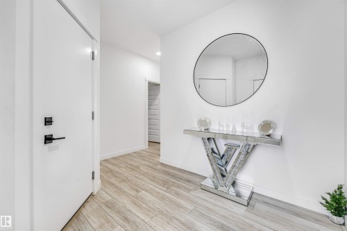 Corridor featuring light wood-style floors and recessed lighting - 2629 15A Avenue, Edmonton, AB - Indoor Photo Showing Other Room