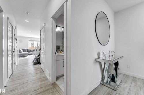 Hall featuring wood finish floors and recessed lighting - 2629 15A Avenue, Edmonton, AB - Indoor Photo Showing Other Room
