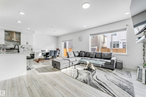 Living area featuring light wood-type flooring and recessed lighting - 2629 15A Avenue, Edmonton, AB - Indoor Photo Showing Living Room