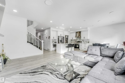 Living room featuring light wood-style floors and recessed lighting - 2629 15A Avenue, Edmonton, AB - Indoor Photo Showing Living Room