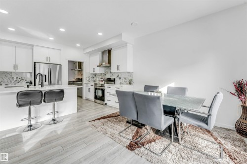 Dining space featuring light wood finished floors and recessed lighting - 2629 15A Avenue, Edmonton, AB - Indoor