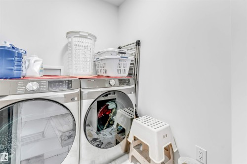 Laundry room featuring washer and dryer - 2629 15A Avenue, Edmonton, AB - Indoor Photo Showing Laundry Room
