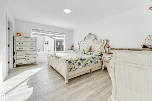Bedroom featuring light wood-style flooring - 2629 15A Avenue, Edmonton, AB - Indoor Photo Showing Bedroom