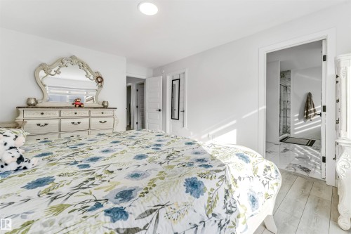 Bedroom with ensuite bath - 2629 15A Avenue, Edmonton, AB - Indoor Photo Showing Bedroom