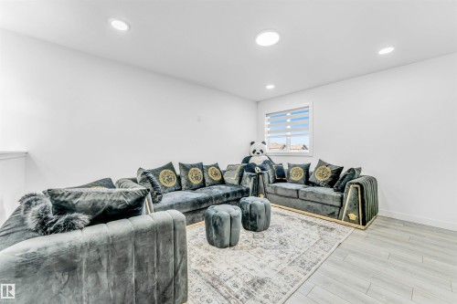 Living room featuring light wood-type flooring and recessed lighting - 2629 15A Avenue, Edmonton, AB - Indoor Photo Showing Living Room